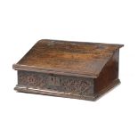 A 17TH CENTURY OAK DESK BOX POSSIBLY WESTMORELAND, C.1650 the sloping hinged lid with a rest,