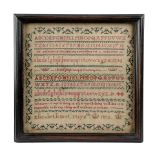 A WILLIAM IV NEEDLEWORK SAMPLER BY ELIZABETH SIRET worked with coloured silks on a linen ground in