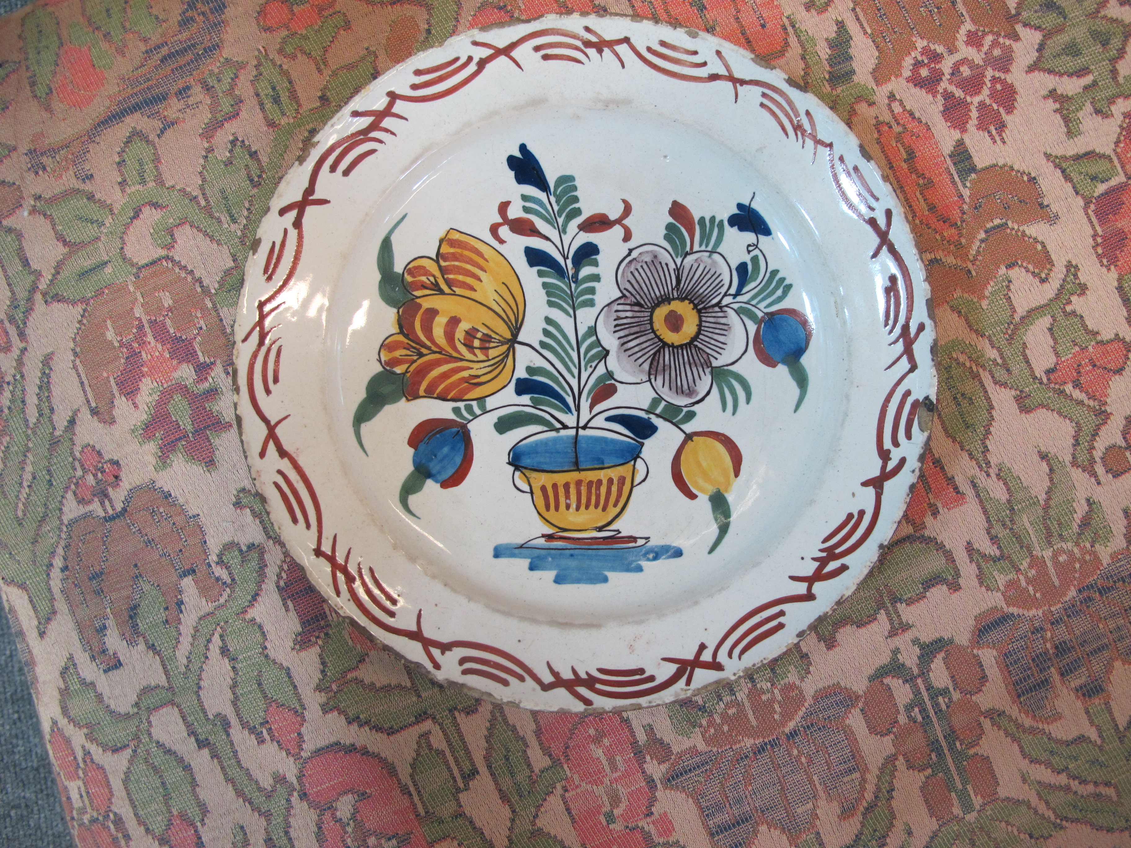 THREE DELFTWARE POTTERY PLATES 18TH CENTURY polychrome decorated with a bird on a fence, and urns of - Image 2 of 24