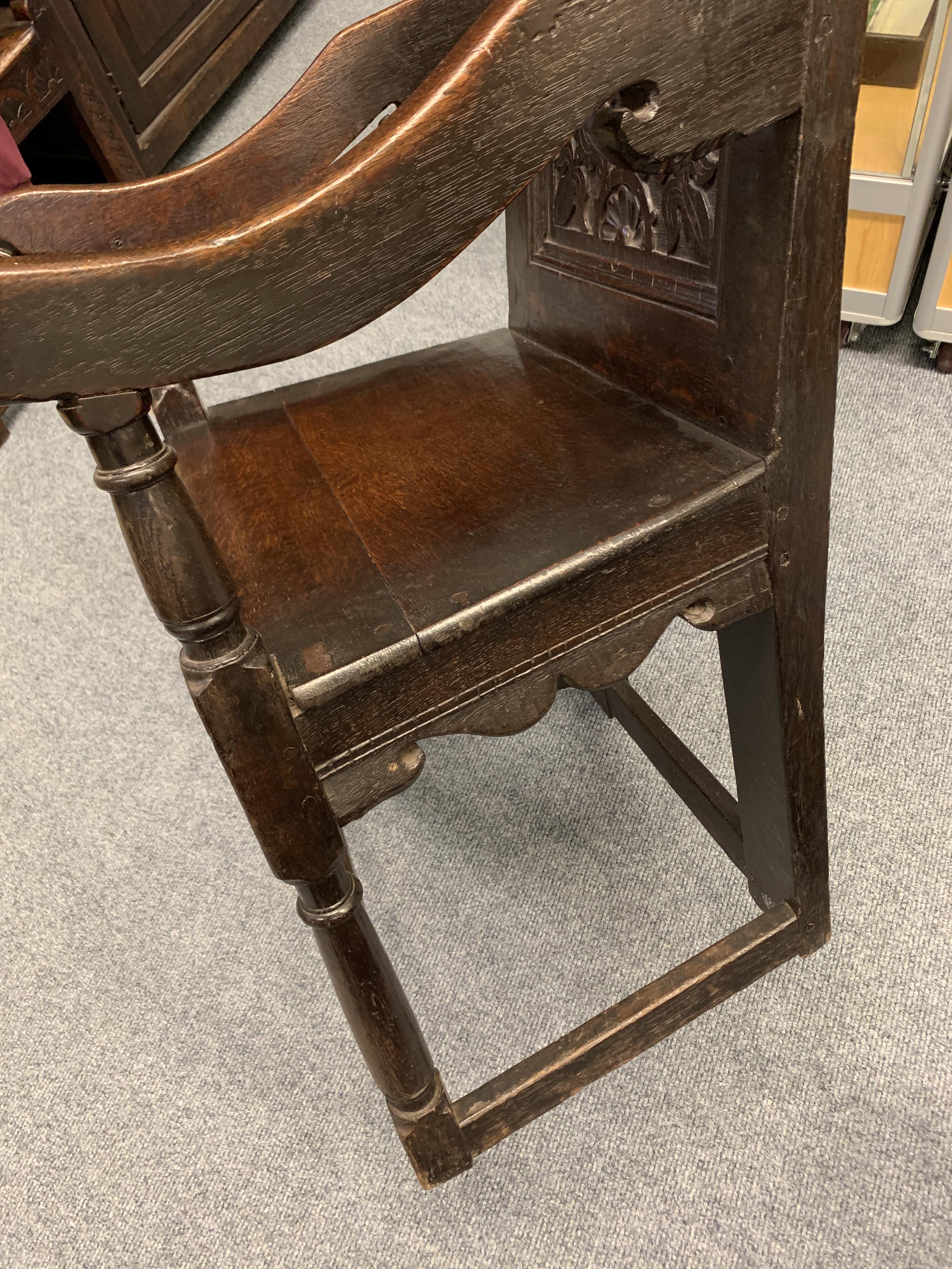 A CHARLES I OAK PANELLED BACK ARMCHAIR DATED '1638' the scroll carved crest centred with a fleur- - Image 9 of 13