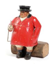 A CARVED AND PAINTED WOOD FIGURE OF A HUNTSMAN IN THE MANNER OF FRANK WHITTINGTON OF FOREST TOYS,