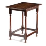 A QUEEN ANNE OAK SIDE TABLE EARLY 18TH CENTURY the rectangular top with a moulded edge, on slender