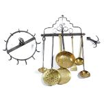 A GEORGE III WROUGHT IRON HANGING RACK THIRD QUARTER 18TH CENTURY with scroll decoration and five