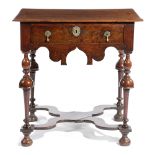 A WILLIAM AND MARY OAK SIDE TABLE C.1690 the rectangular top with a moulded edge, above a frieze