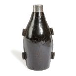 A LEATHER FLASK MID-18TH CENTURY of bottle form, the spout with a silver rim engraved with a