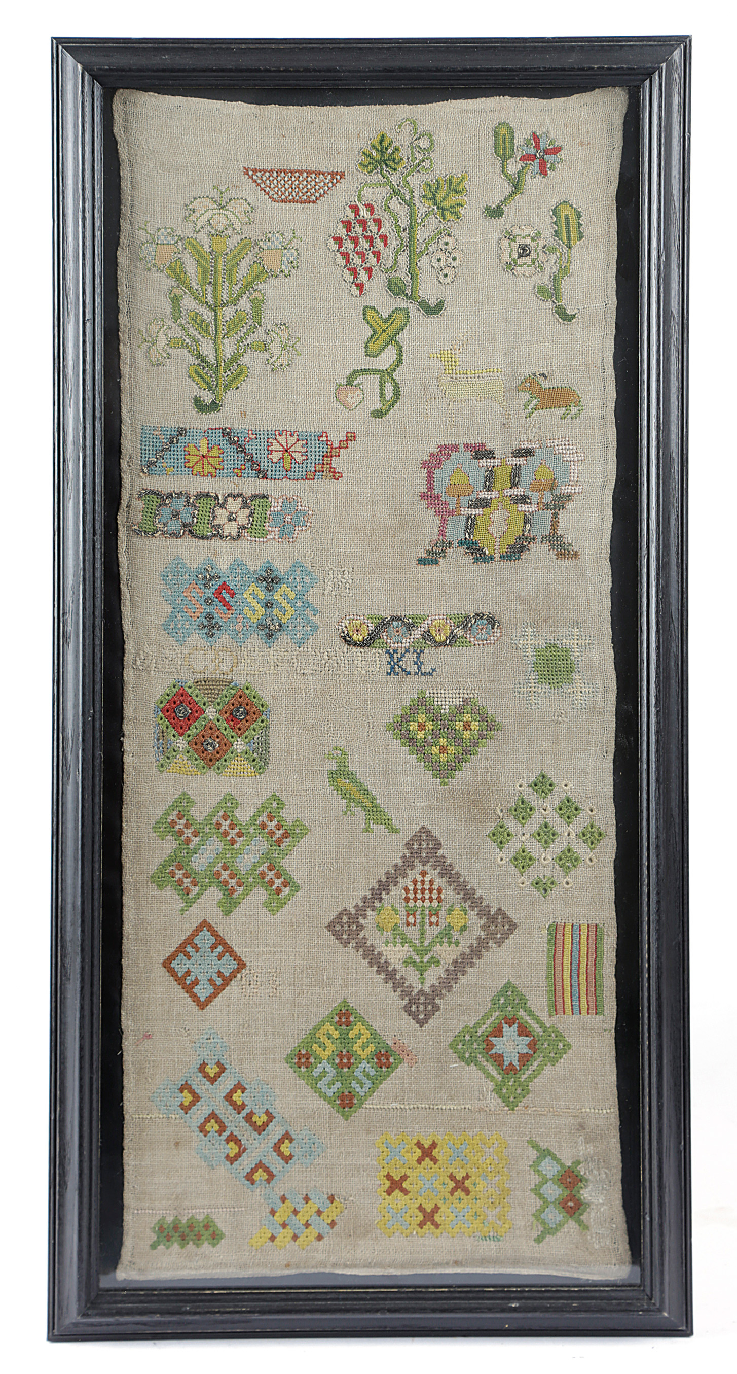 A RARE NEEDLEWORK SPOT SAMPLER MID-17TH CENTURY AND LATER worked with polychrome silk floss on an