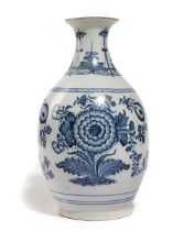 A DELFT POTTERY BLUE AND WHITE VASE EARLY 18TH CENTURY of pear shape, with an everted rim, painted
