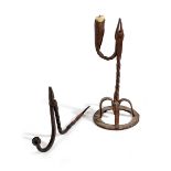 A WROUGHT IRON TABLE RUSHNIP AND CANDLEHOLDER IRISH, 18TH CENTURY with a spiral twist stem, on a