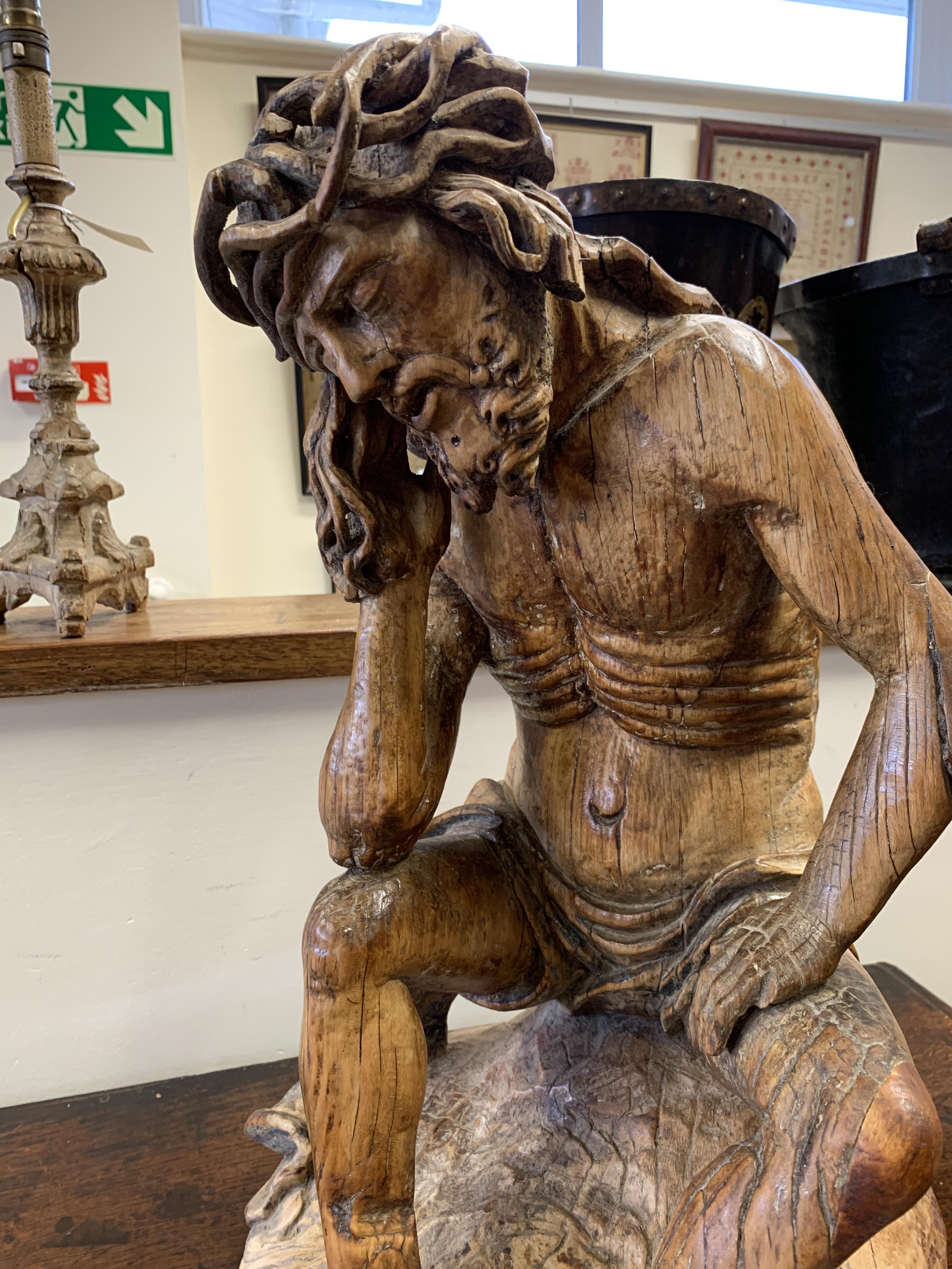 A GERMAN CARVED LIMEWOOD FIGURE OF CHRIST THE MAN OF SORROWS 16TH CENTURY depicted seated wearing - Image 6 of 22