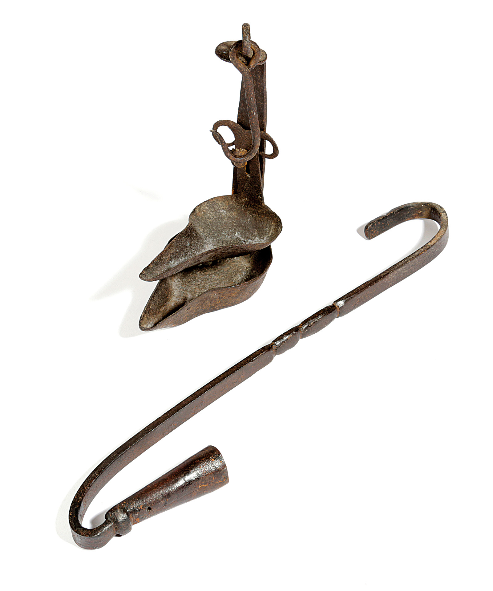 A WROUGHT IRON HANGING CANDLEHOLDER 18TH CENTURY with an upper hook and moulded decoration to the