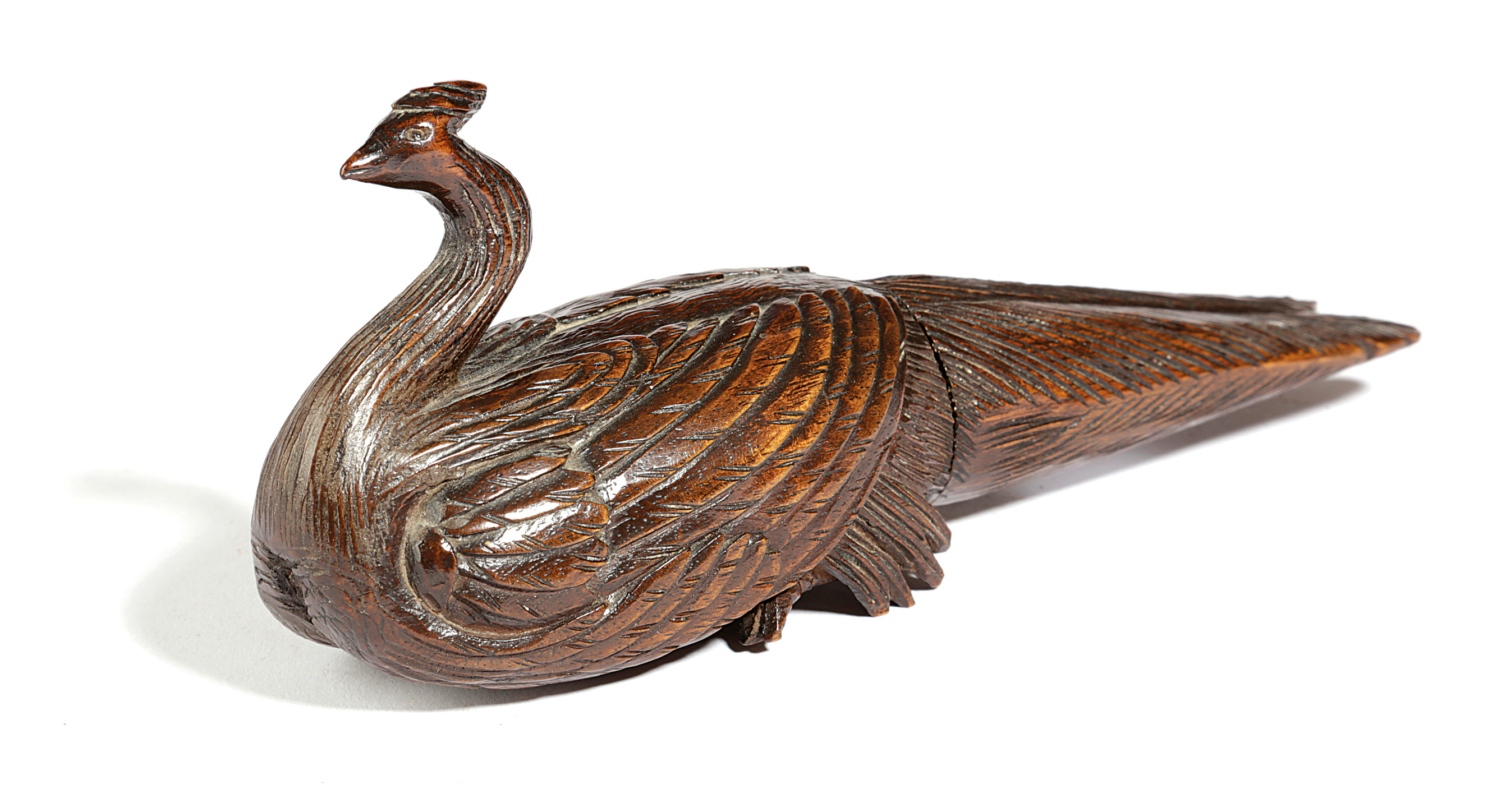 A SWISS TREEN NUTCRACKER LATE 19TH CENTURY in the form of a peacock, with a screw-action 19.2cm long