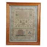 A REGENCY NEEDLEWORK SAMPLER BY CAROLINE WILKINSON worked with coloured silks on a fine linen