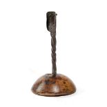 A WROUGHT IRON AND TREEN TABLE CANDLEHOLDER PROBABLY IRISH, 18TH CENTURY with a spiral twist stem on