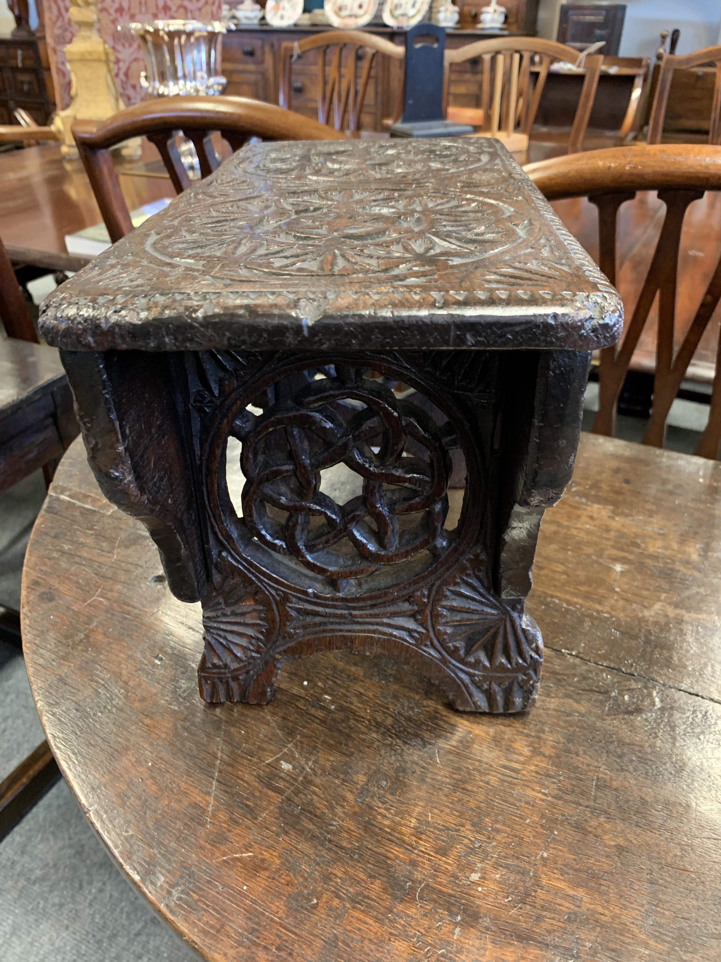 A GEORGE III CHIP CARVED STOOL WELSH, DATED '1778' relief decorated with rondels, the trestle ends - Image 8 of 9