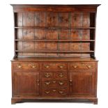 A GEORGE III OAK DRESSER LATE 18TH / EARLY 19TH CENTURY the raised plate rack with three shelves,