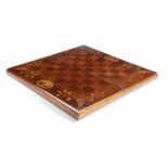 AN IRISH YEW AND MARQUETRY FOLDING GAMES BOARD KILLARNEY, C.1860 inlaid with leaves and oval