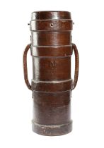 A LEATHER ARTILLERY SHELL STICKSTAND with a pair of lug handles and a metal liner 74.5cm high