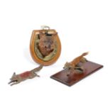 AN AUSTRIAN COLD PAINTED RUNNING FOX DESK PAPERCLIP EARLY 20TH CENTURY mounted on an oak base,