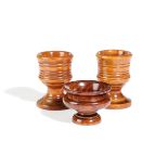 λ A NEAR PAIR OF TREEN EGGCUPS OR SALTS LATE 18TH / EARLY 19TH CENTURY possibly boxwood, turned with