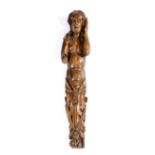 A WALNUT FIGURAL TERM POSSIBLY FLEMISH OR FRENCH, LATE 16TH CENTURY carved with a semi-naked