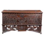 AN OAK CHEST 17TH CENTURY the later hinged top with a moulded edge, revealing an interior with a