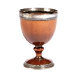 A TREEN SILVER MOUNTED PEARWOOD GOBLET 18TH CENTURY with an unmarked silver rim and foot 10.2cm high