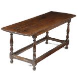 AN OAK COFFEE TABLE EARLY 18TH CENTURY ELEMENTS on baluster turned legs 53cm high, 45cm wide, 131.