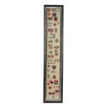 A VICTORIAN LONG NEEDLEWORK SPOT SAMPLER PROBABLY 1884 in the style of Berlin woolwork, worked in