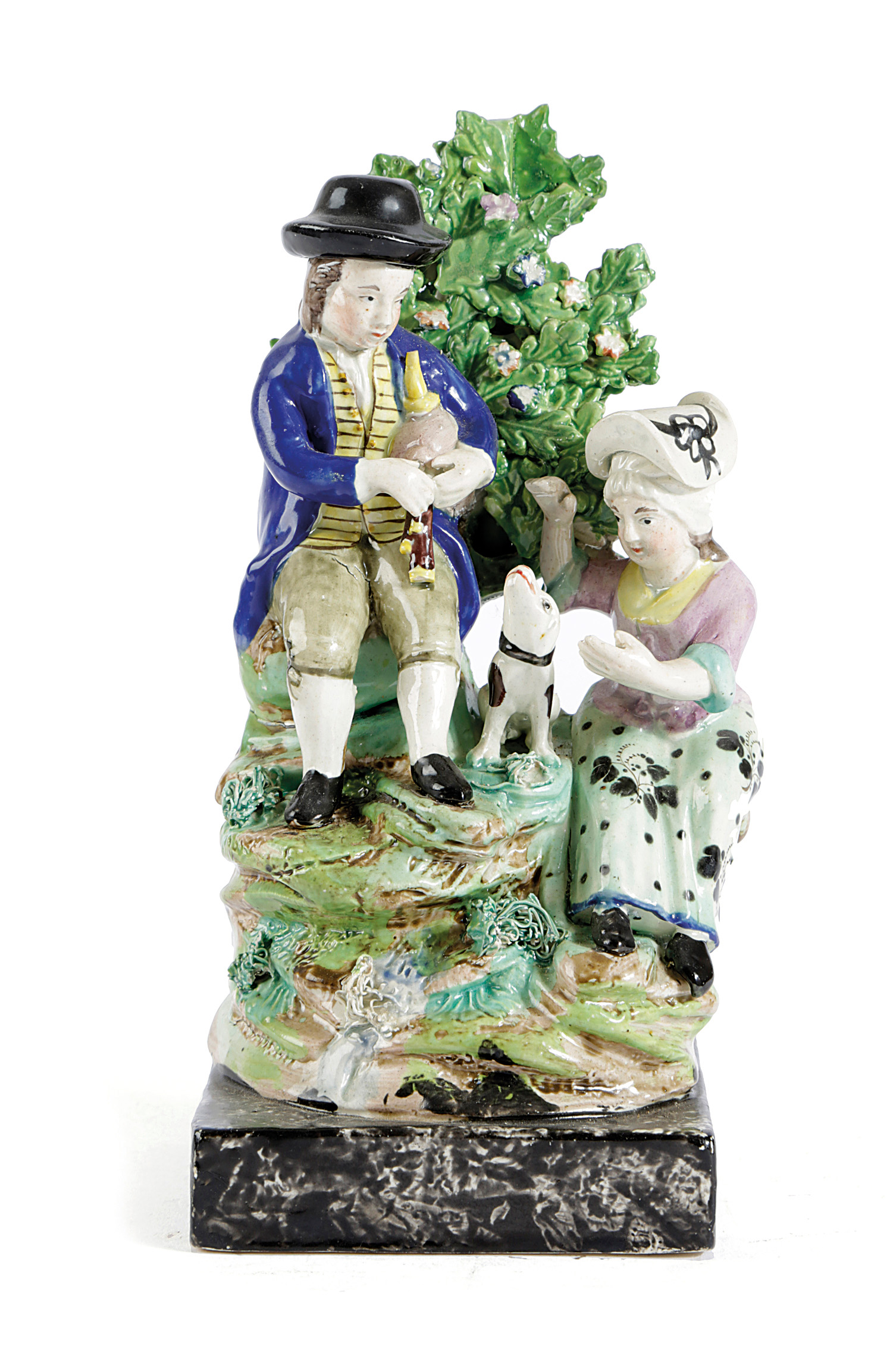 A STAFFORDSHIRE PEARLWARE POTTERY GROUP EARLY 19TH CENTURY depicting rural pastimes, with a man