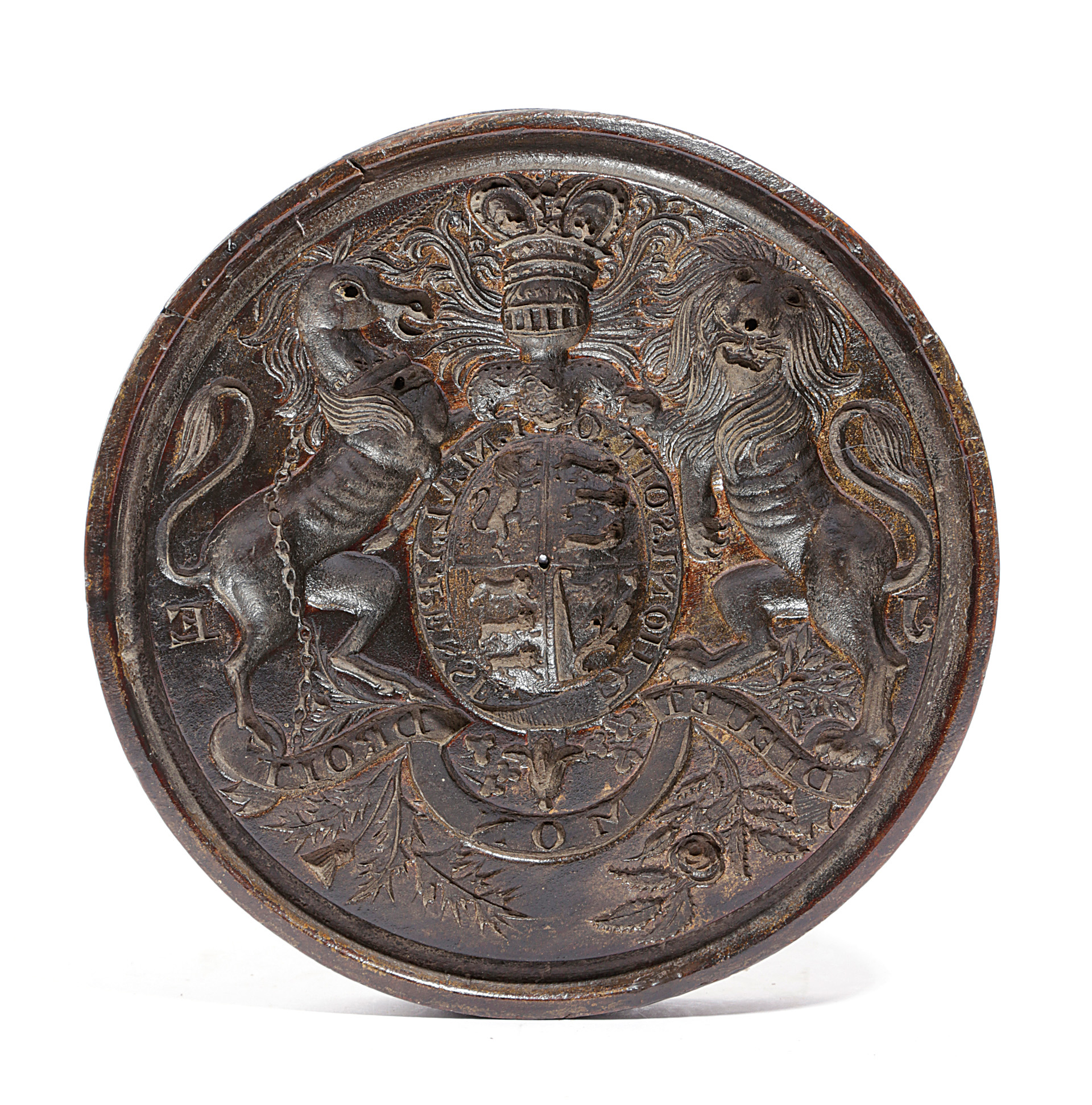 A TREEN CONFECTIONERY MOULD MID-19TH CENTURY intaglio relief carved with the Royal Coat of Arms, the