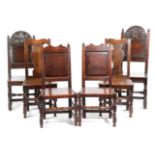 A PAIR OF OAK BACKSTOOLS LATE 17TH CENTURY each with a shaped top rail above a fielded panel and a