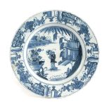 A DELFTWARE POTTERY CHARGER PROBABLY LIVERPOOL, MID-18TH CENTURY painted in blue in Chinese style