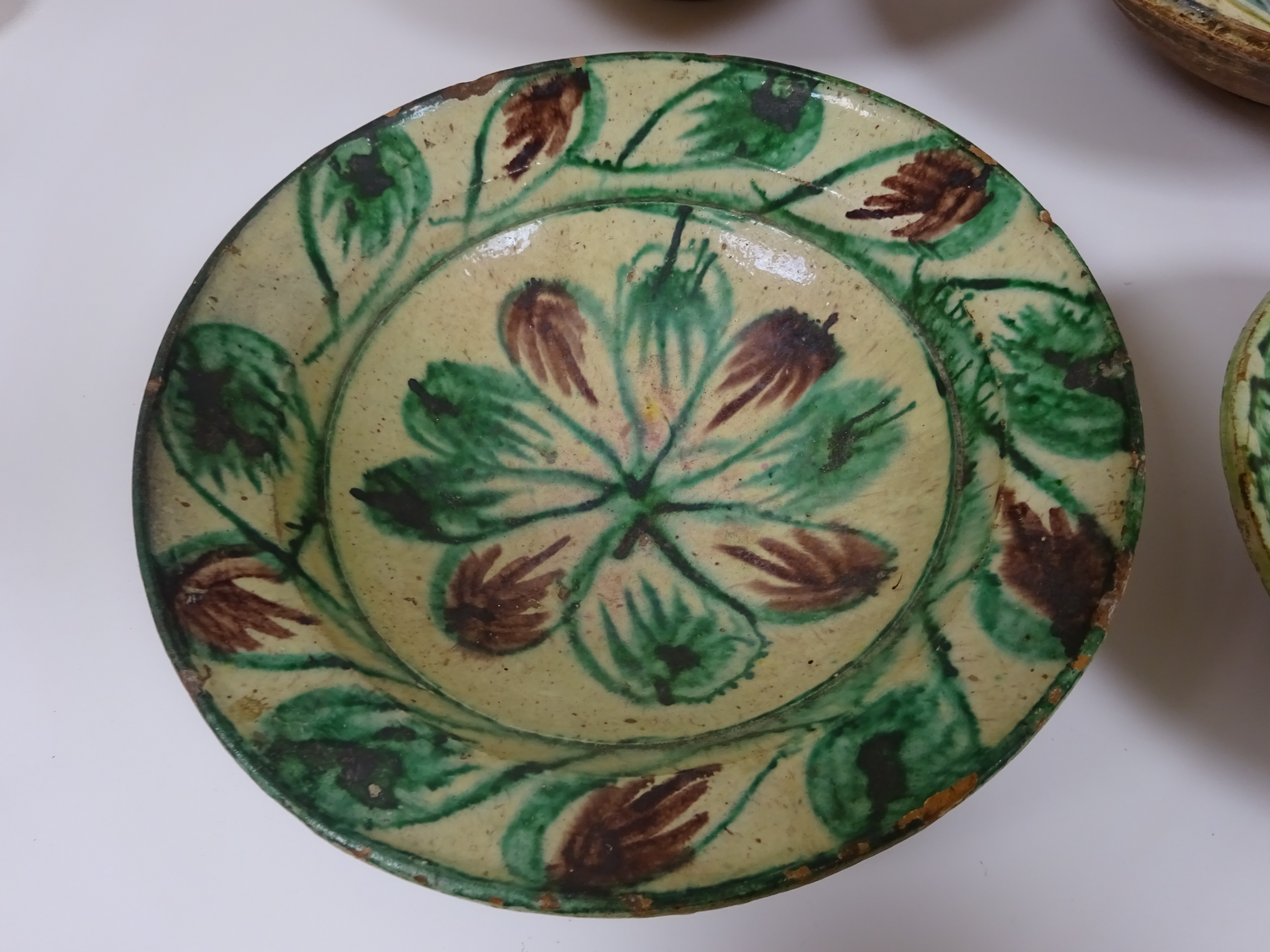 THREE SPANISH TIN-GLAZED POTTERY BOWLS 19TH / 20TH CENTURY each painted with flowers and a smaller - Image 4 of 13