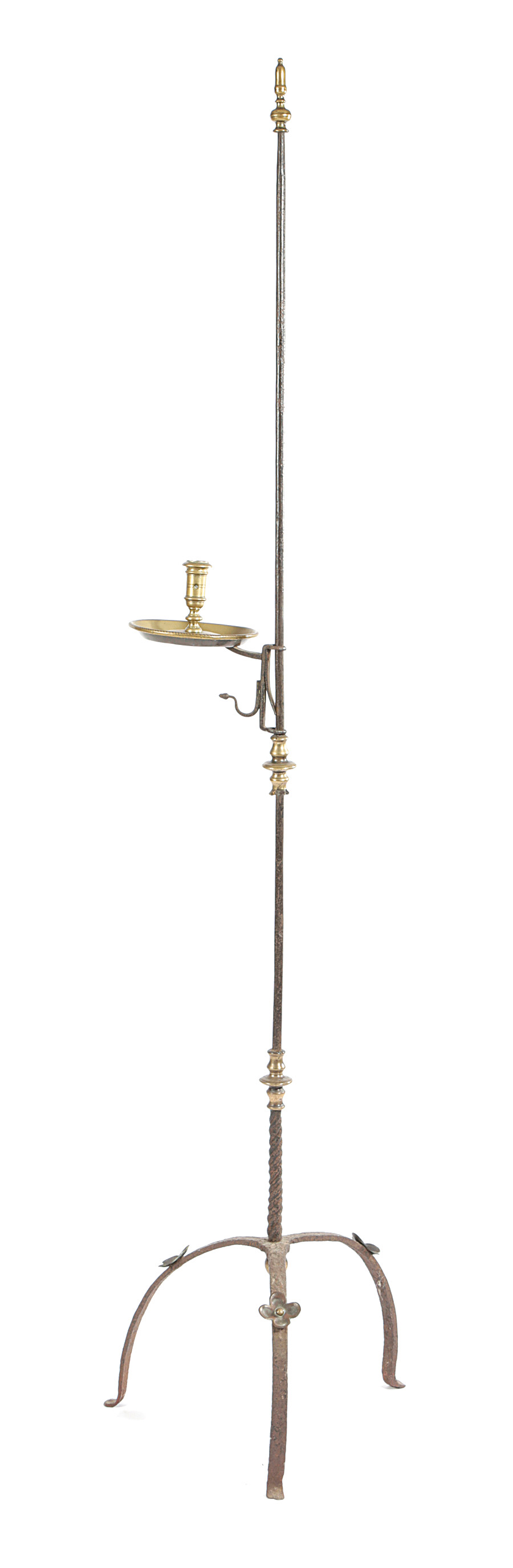 A WROUGHT IRON AND BRASS MOUNTED STANDING CANDLE HOLDER 18TH CENTURY with a turned acorn finial