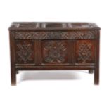 A CHARLES II OAK COFFER C.1670 the triple panelled hinged top revealing a vacant interior with a