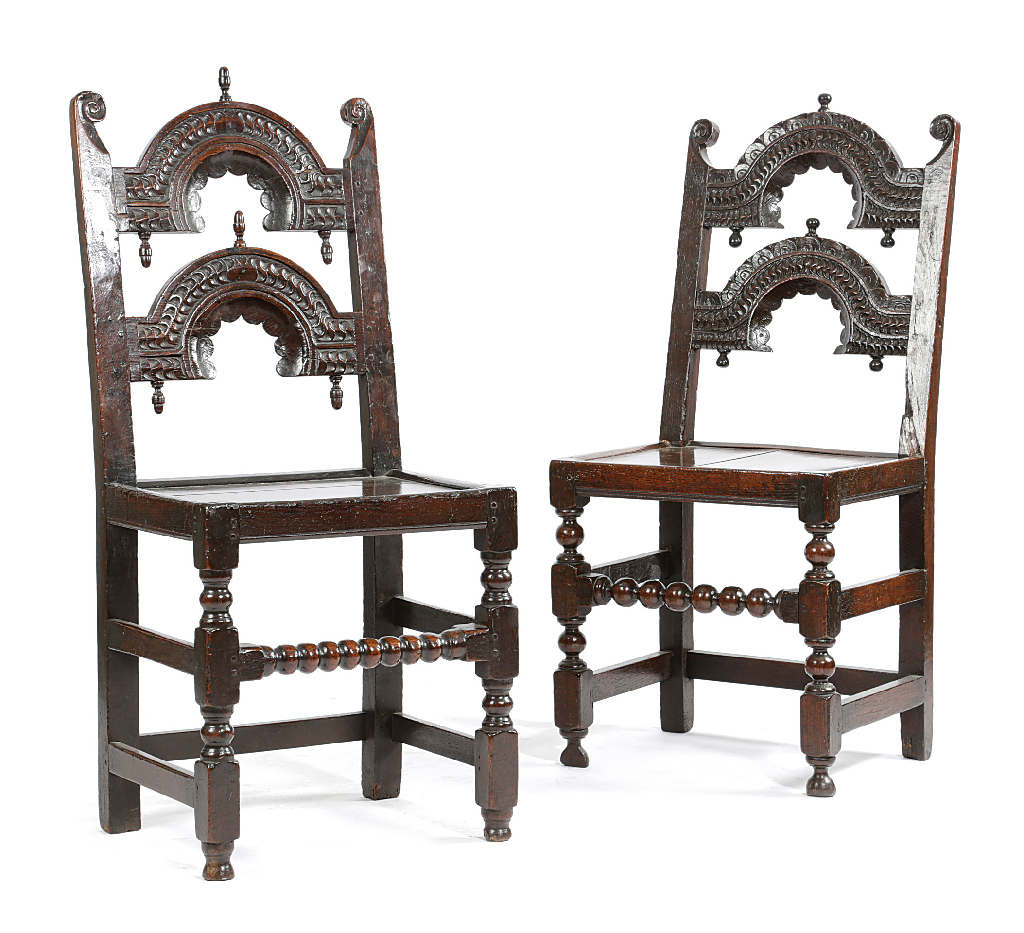 TWO CHARLES II OAK 'YORKSHIRE' CHAIRS C.1670 each with scroll uprights and twin arched backs