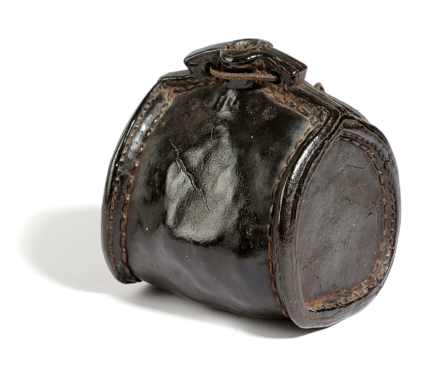 A LEATHER COSTREL LATE 17TH / EARLY 18TH CENTURY of shouldered form, with an open spout, pierced