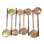 EIGHT ASSORTED COPPER AND BRASS WARMING PANS 18TH CENTURY AND LATER each with a turned wood