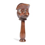 A SWISS TREEN NOVELTY NUTCRACKER 19TH CENTURY carved as a bust of a man wearing a tricorn hat,