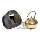 A BRASS KETTLE LATE 18TH / EARLY 19TH CENTURY with a swing handle and on three ball feet, together
