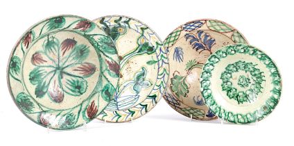 THREE SPANISH TIN-GLAZED POTTERY BOWLS 19TH / 20TH CENTURY each painted with flowers and a smaller