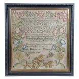 A GEORGE III NEEDLEWORK SAMPLER BY HANNAH BACKHOUSE worked with polychrome silks on a linen