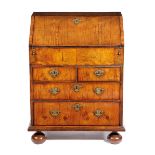 *Estimate amended after the sale was published.* A SMALL QUEEN ANNE WALNUT BUREAU EARLY 18TH CENTURY