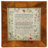 A GEORGE IV NEEDLEWORK SAMPLER BY ELIZA J worked in bright colourful floss silks on a linen