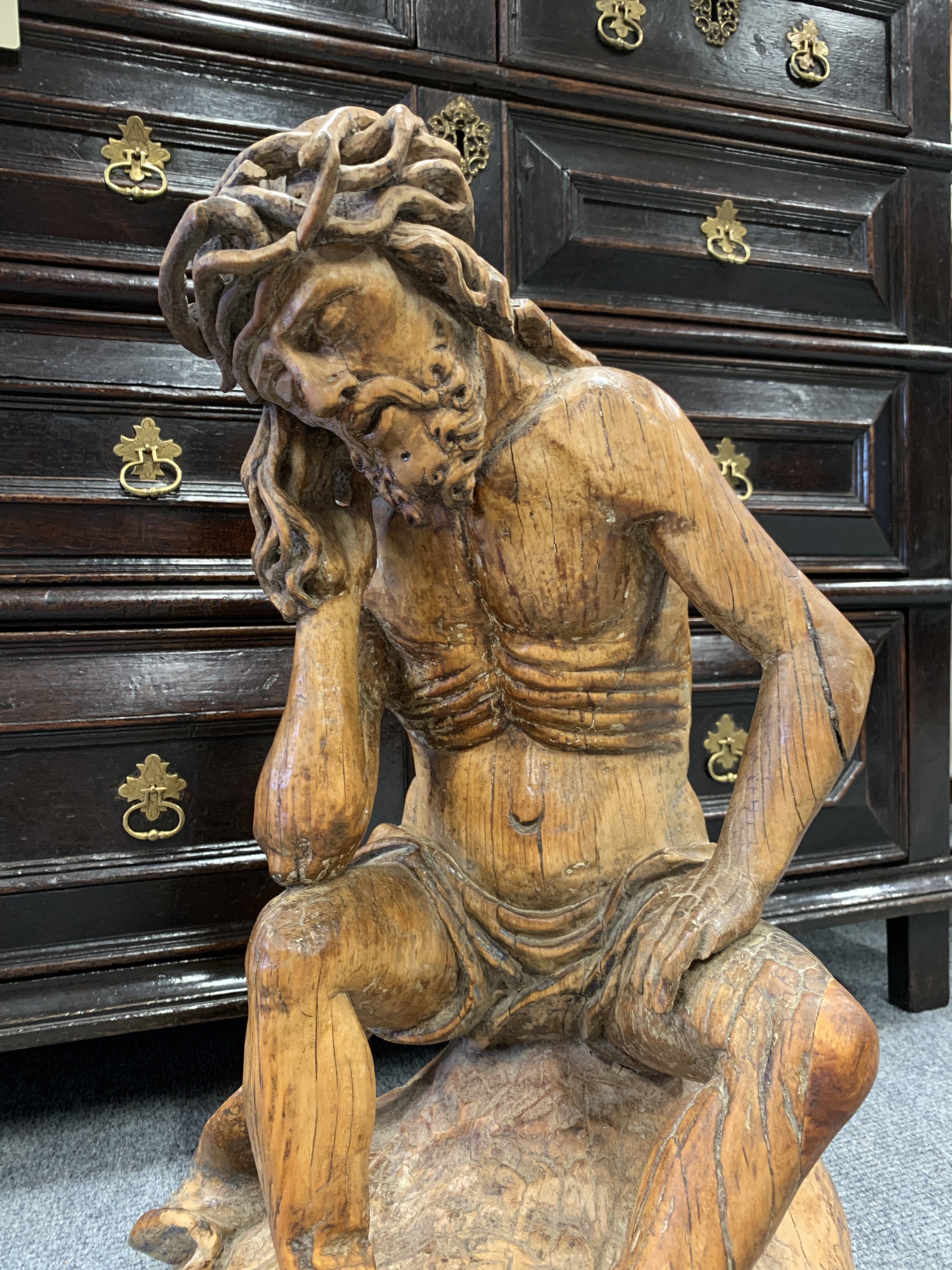 A GERMAN CARVED LIMEWOOD FIGURE OF CHRIST THE MAN OF SORROWS 16TH CENTURY depicted seated wearing - Image 4 of 22