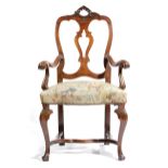 AN ITALIAN WALNUT OPEN ARMCHAIR 18TH CENTURY in Rococo style, with a pierced splat and a floral