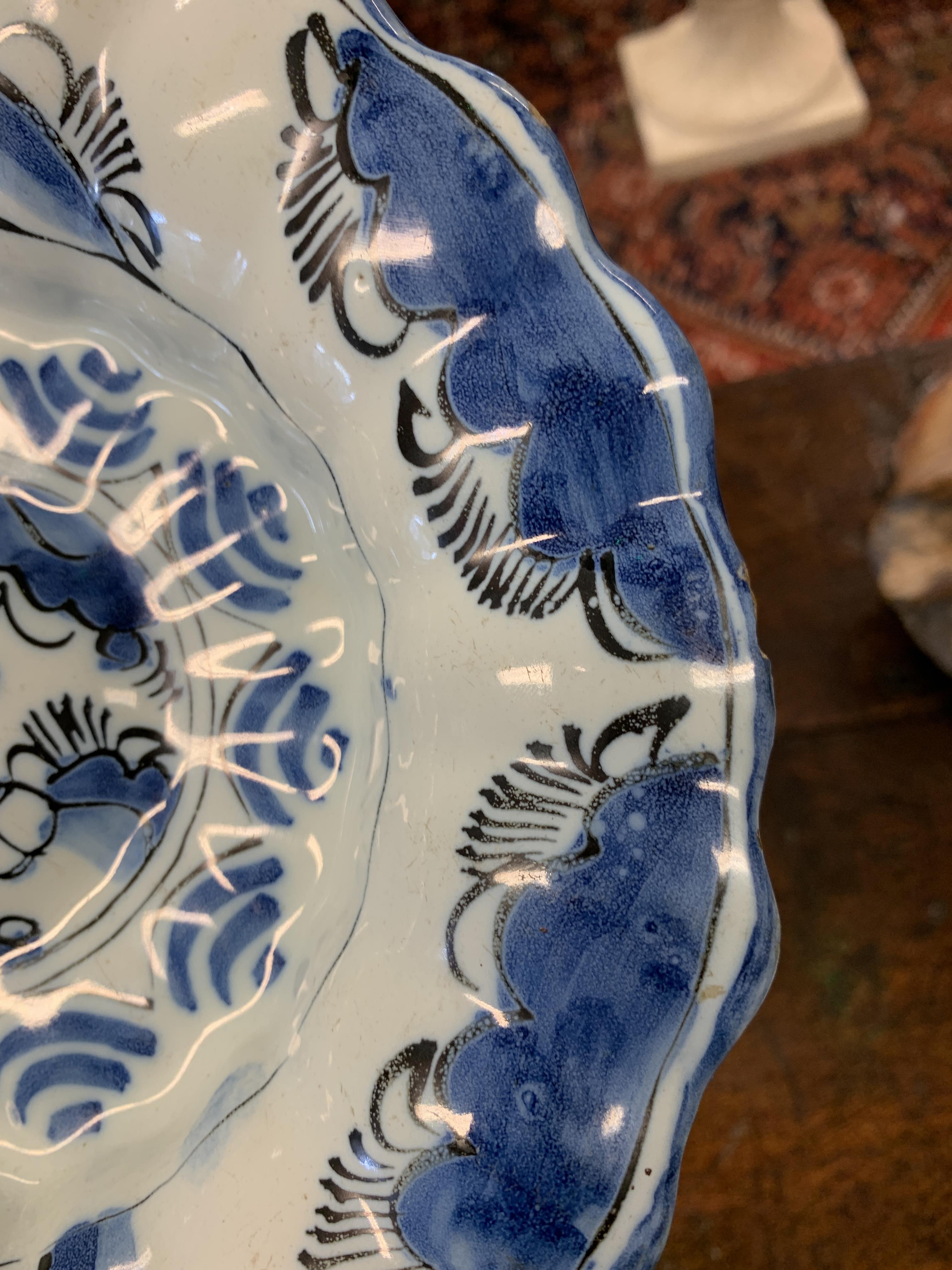 TWO DELFT POTTERY LOBED DISHES EARLY 18TH CENTURY each painted in blue and black with a seated - Image 7 of 16