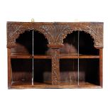 A COMMONWEALTH OAK MURAL GLASS CASE MID-17TH CENTURY the arcaded open front carved with scrolling