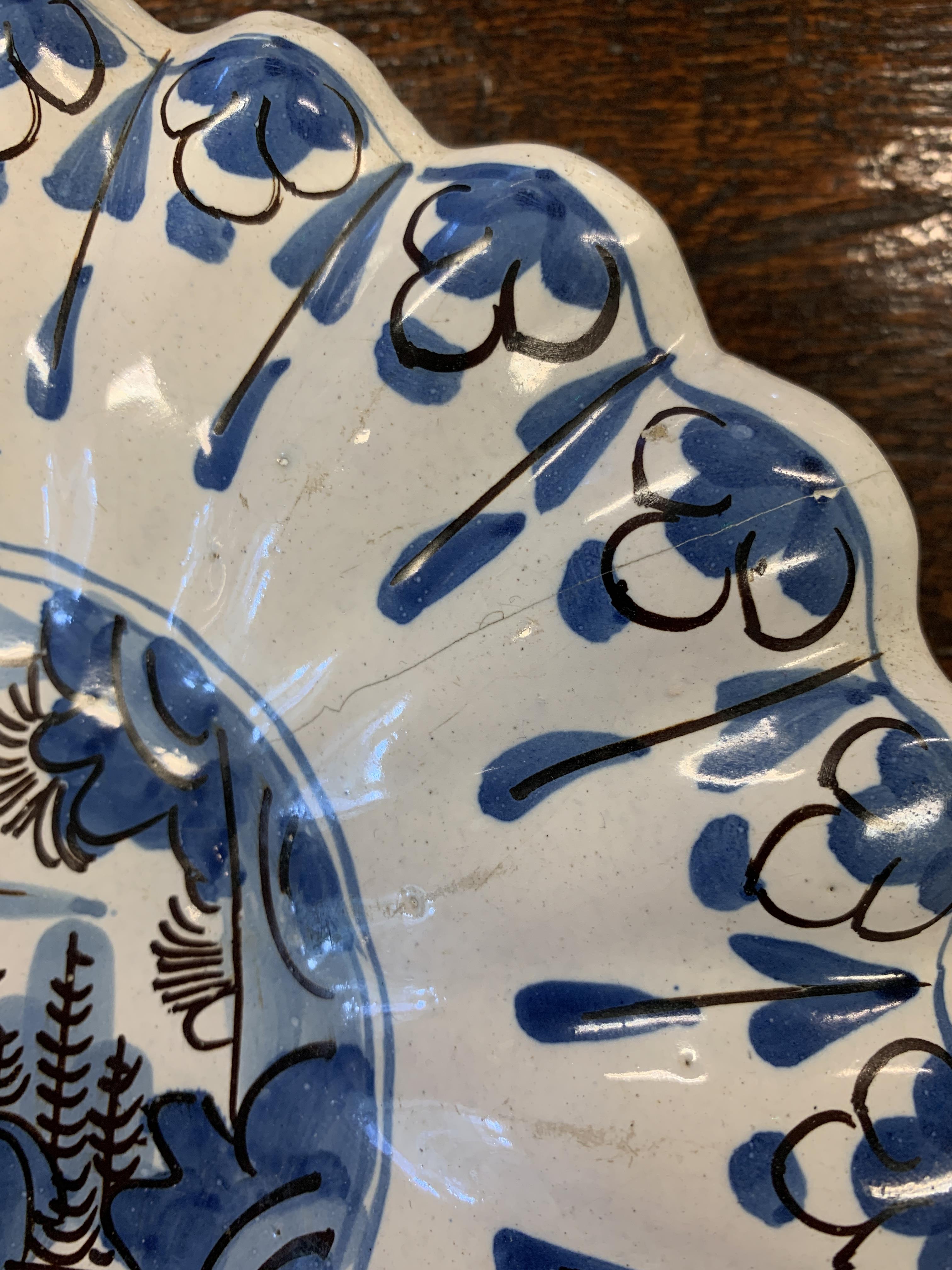 TWO DELFT POTTERY LOBED DISHES EARLY 18TH CENTURY each painted in blue and black with a seated - Image 11 of 16