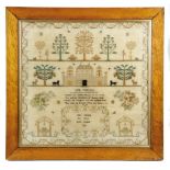 A GEORGE III NEEDLEWORK SAMPLER BY JANE CHRISTIE worked with coloured silks on a linen ground in